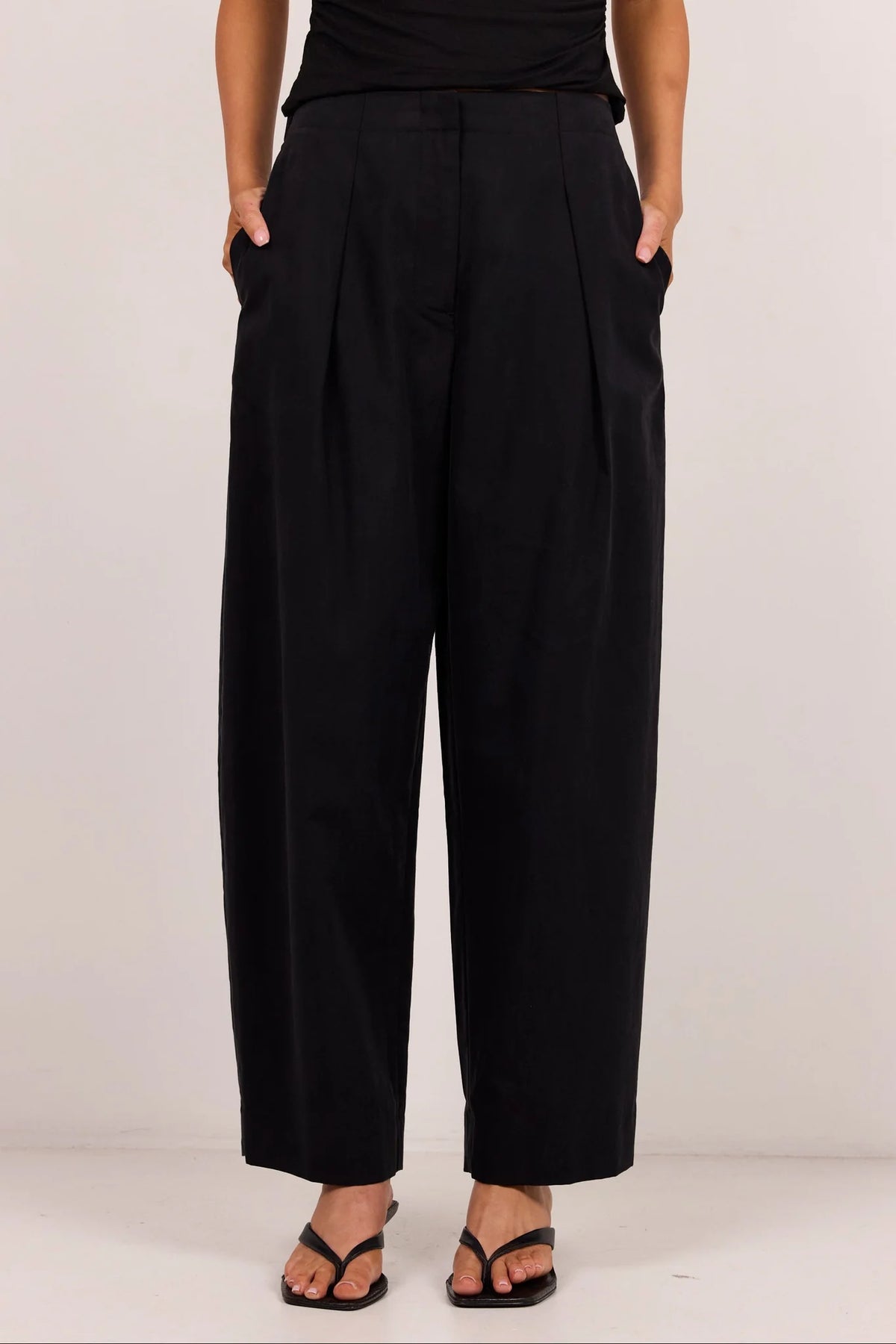 Manifesto black front pleat barrel leg pants