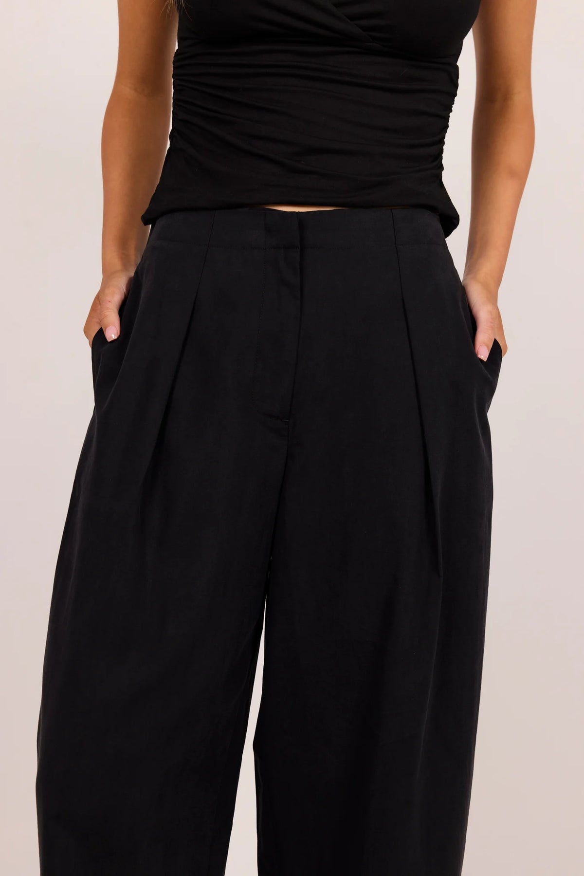 Manifesto black front pleat barrel leg pants